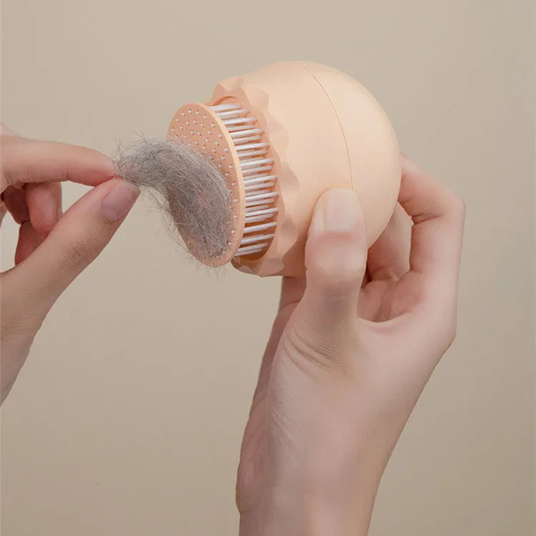 Floating massage pet needle comb with soft silicone brush head for cat hair cleaning, 75x75x73 mm, in orange pink colour