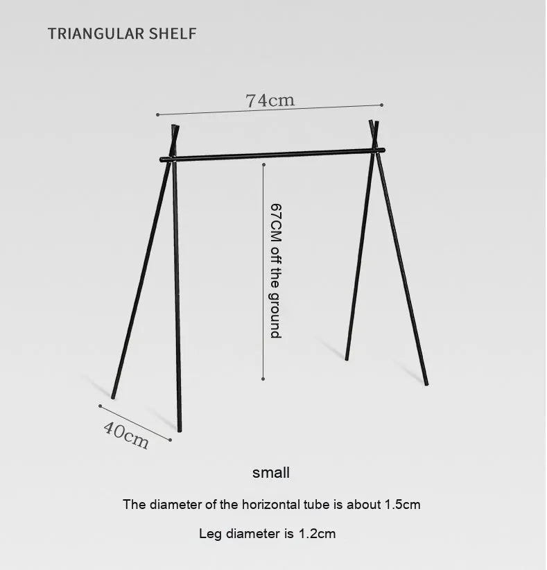 Aluminium alloy portable folding clothes drying rack with triangular frame and top tray, set up outdoors.