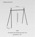 Aluminium alloy portable folding clothes drying rack with triangular frame and top tray, set up outdoors.
