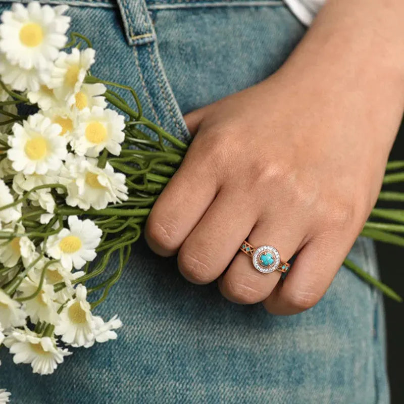 Rose gold copper women's ring with turquoise geometric design and micro inlaid zircon stones.