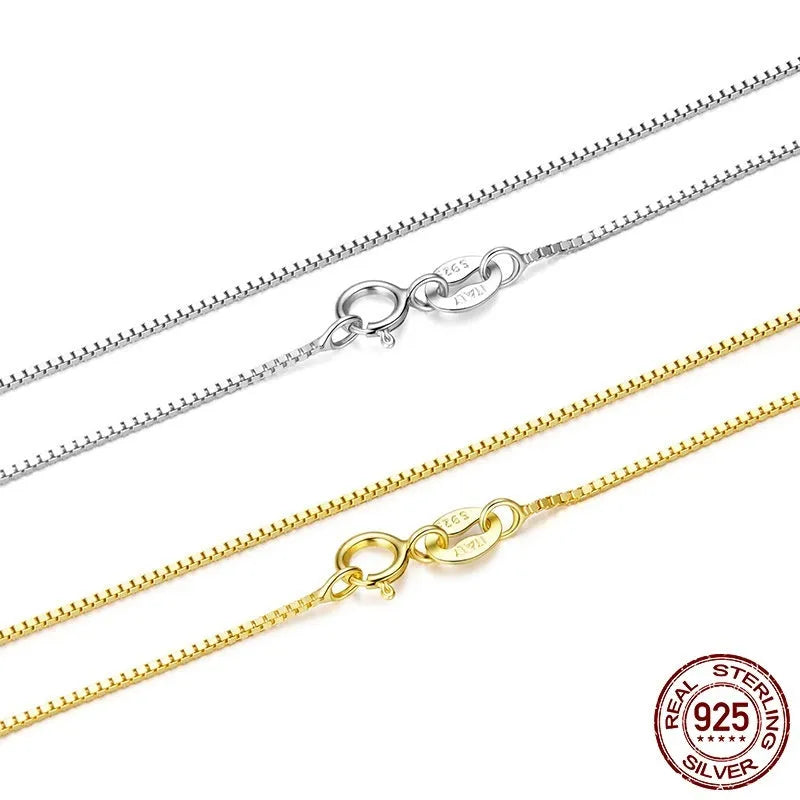 S925 sterling silver box chain necklace in silver colour, 40cm length on flat surface