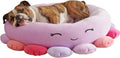 Large Squishmallows plush pet bed in green with bolster edges and non-skid bottom on floor