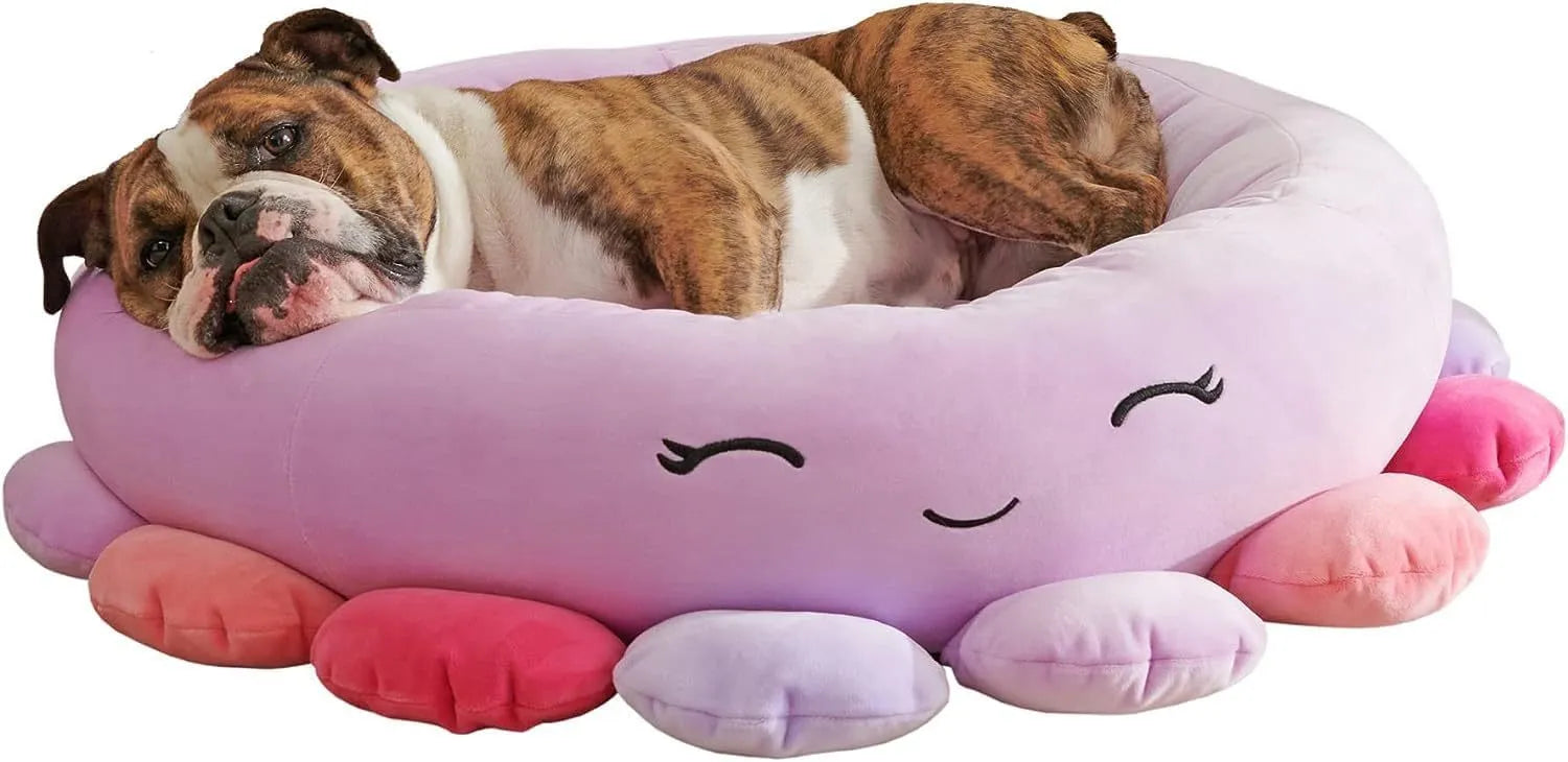 Large Squishmallows plush pet bed in green with bolster edges and non-skid bottom on floor