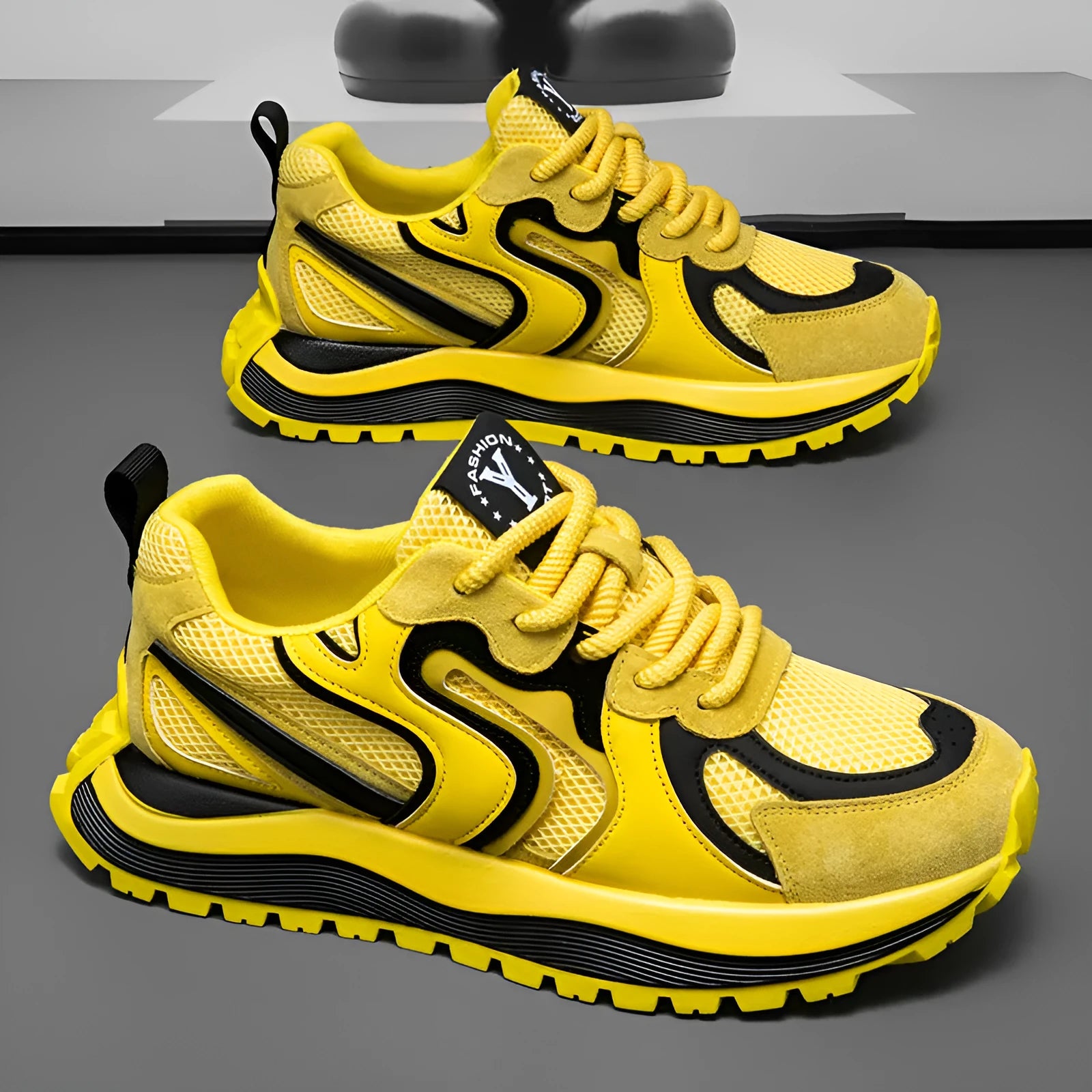 Men's yellow casual sneakers with mesh panels, round toe, and rubber sole displayed from side view