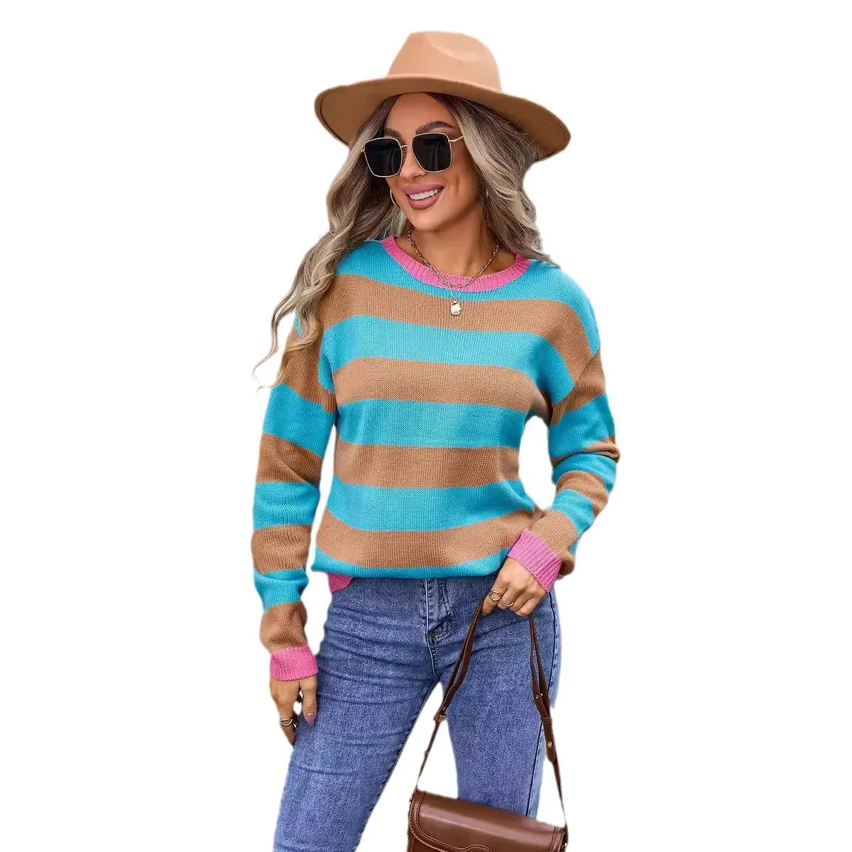 Loose fit blue women's acrylic sweater with round neck and long sleeves laid flat.