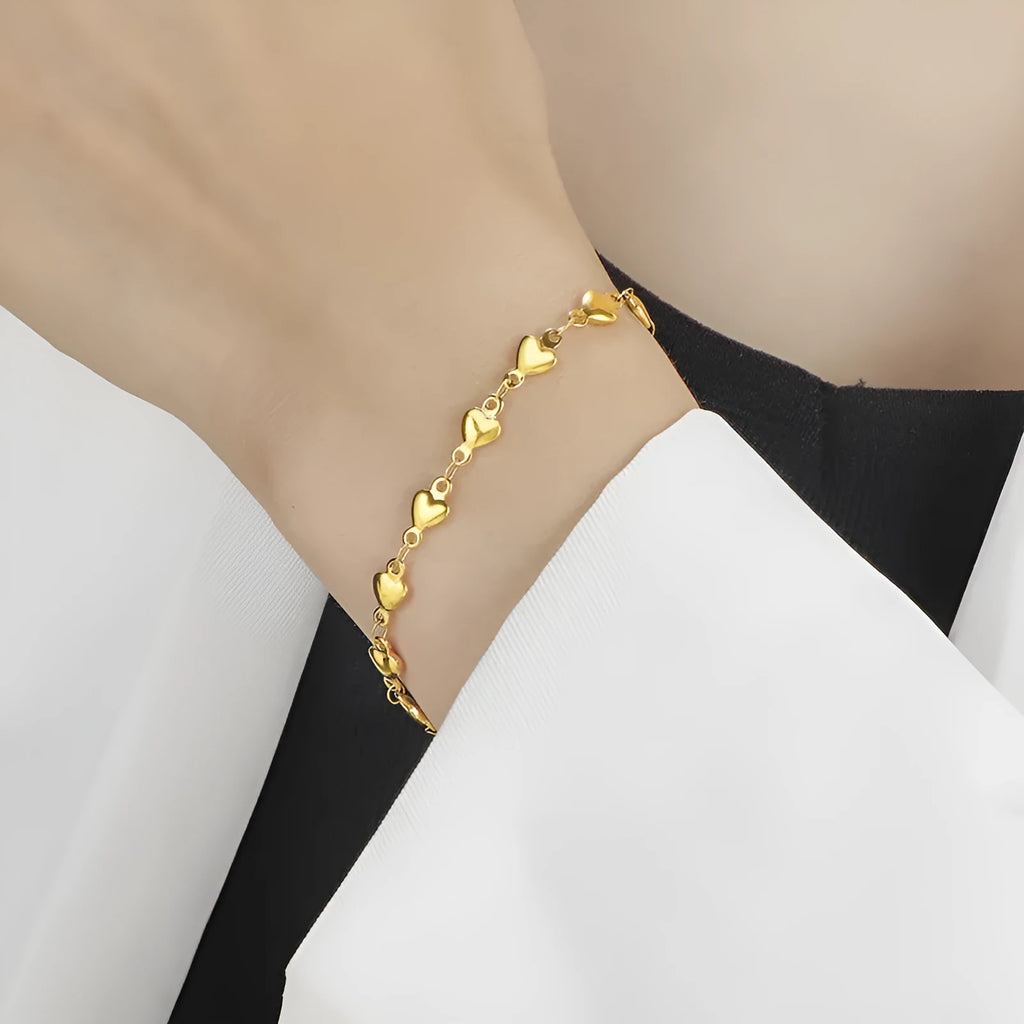 Titanium steel gold chain heart bracelet electroplated colour for women on white background