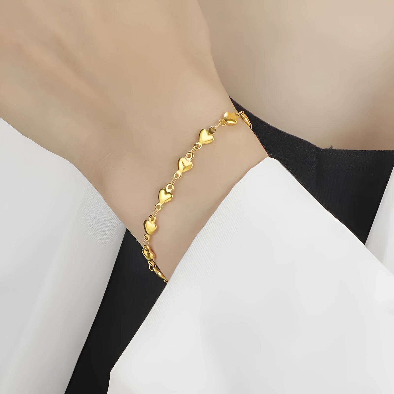 Titanium steel gold chain heart bracelet electroplated colour for women on white background