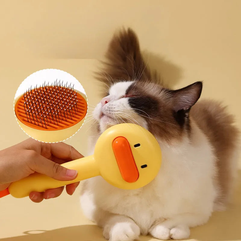 Small yellow duck comb with needle pins for pet hair removal on cats and dogs