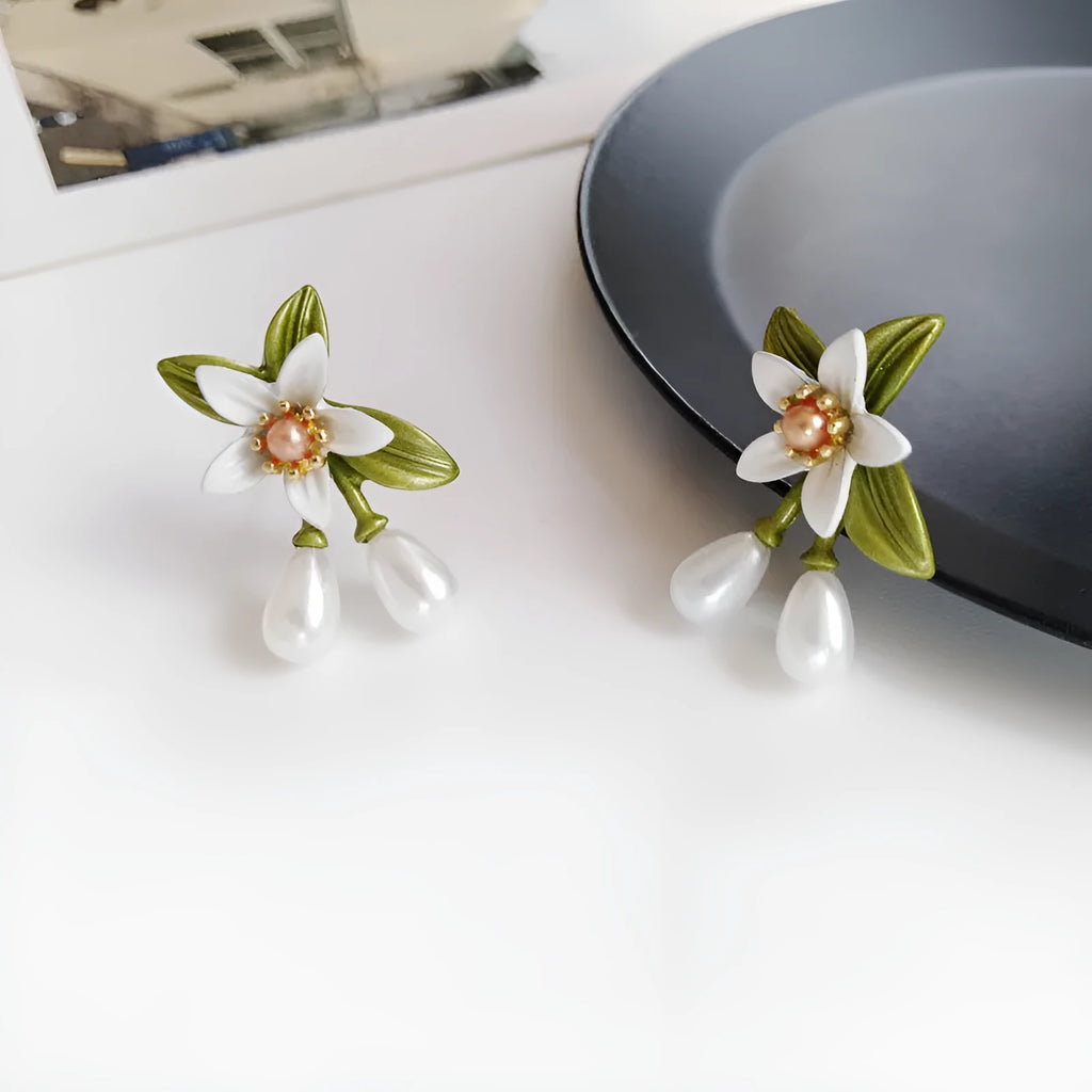 Alloy flower ear stud and clip set with sterling silver needle camellia design and contrasting colour floral motif