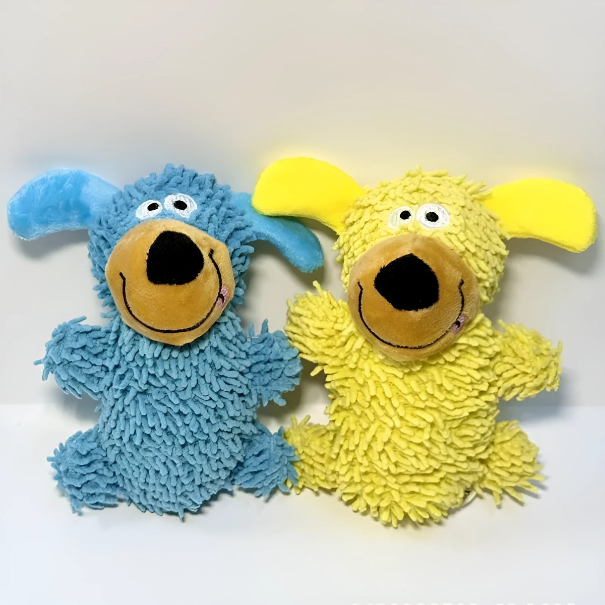Squeaky plush dog toy in blue with cheerful dog shape and built-in squeaker