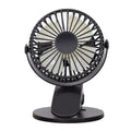 White USB rechargeable clip fan with plastic blades attached to a stroller handle.
