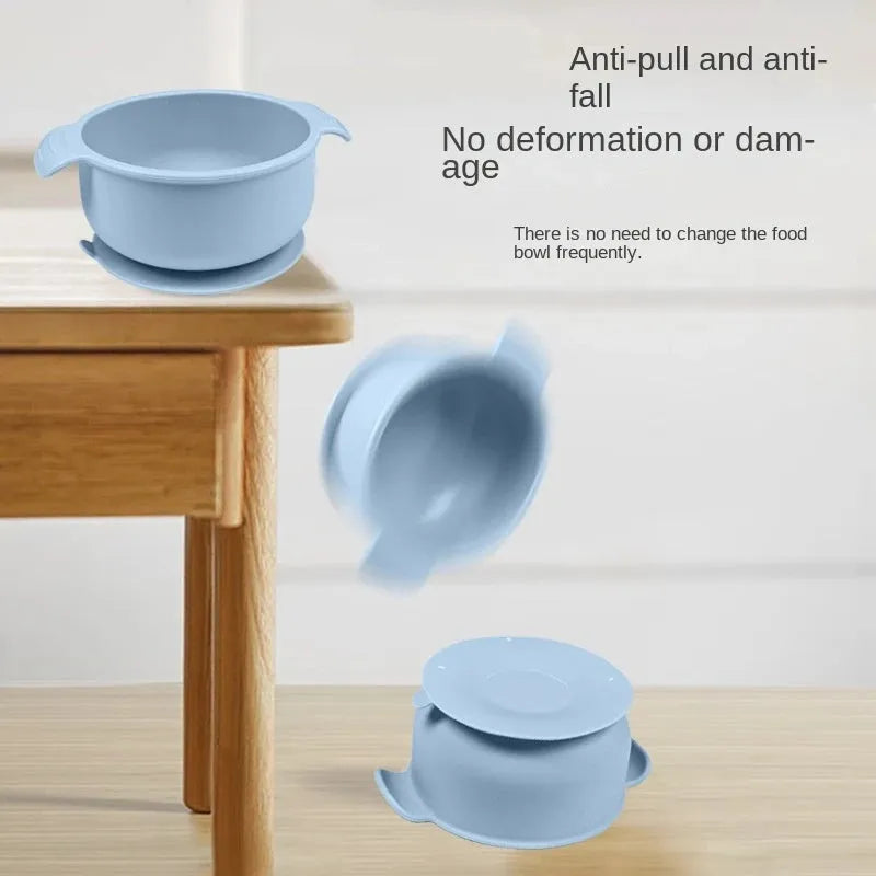 Blue silicone pet bowl for dogs and cats with a non-slip suction cup base on a hardwood floor.