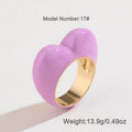 Colourful three-dimensional heart-shaped enamel ring made from zinc alloy, shown in red.