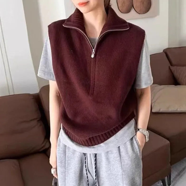 Retro half zip sleeveless knit vest in orange with 3D pattern detail