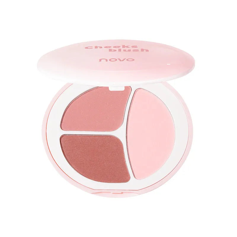 Tricolor blush palette showing three matte shades: peach, apricot, and mauve-pink