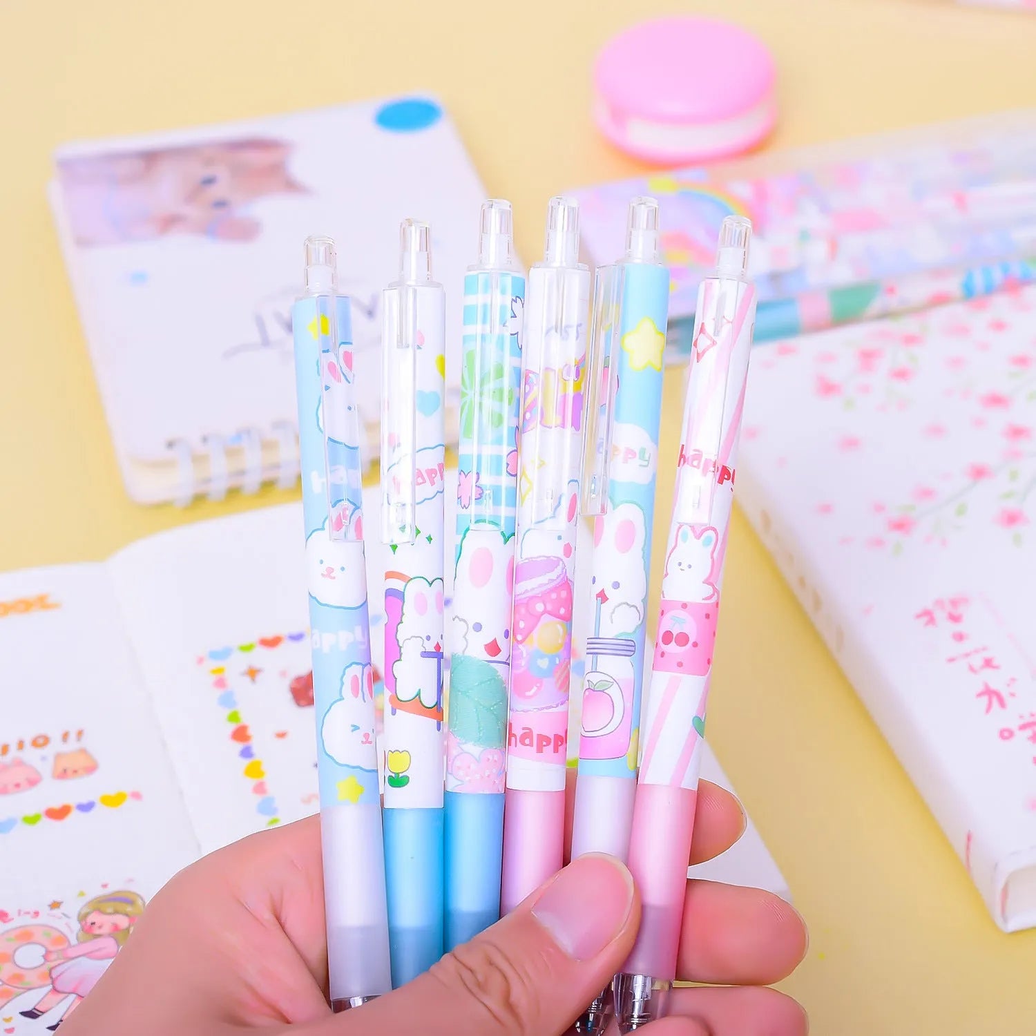Six cartoon bunny design pens with 0.5mm tips and neutral black ink in plastic shells
