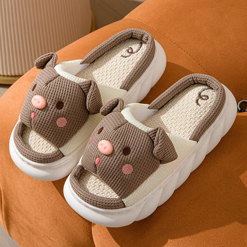 A pair of open-toe linen flip flop slippers for couples, shown in a choice of colours with a cushioned footbed.