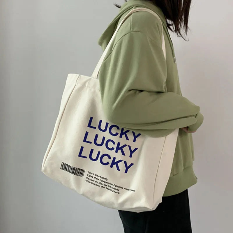 Natural canvas tote bag 32x31.5x10cm with bottom and side panels, small pocket, and metal magnet buckle