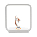 Blue and yellow atmosphere table lamp with integrated wireless phone charging surface