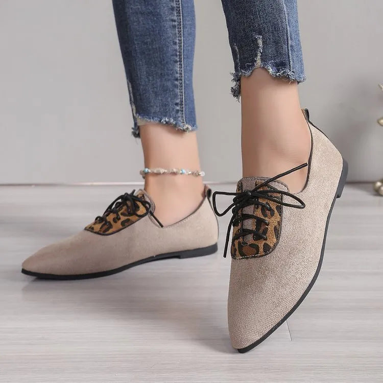 Beige leopard print pointed toe court shoes for women with a low block heel, shown in a plus size fit.