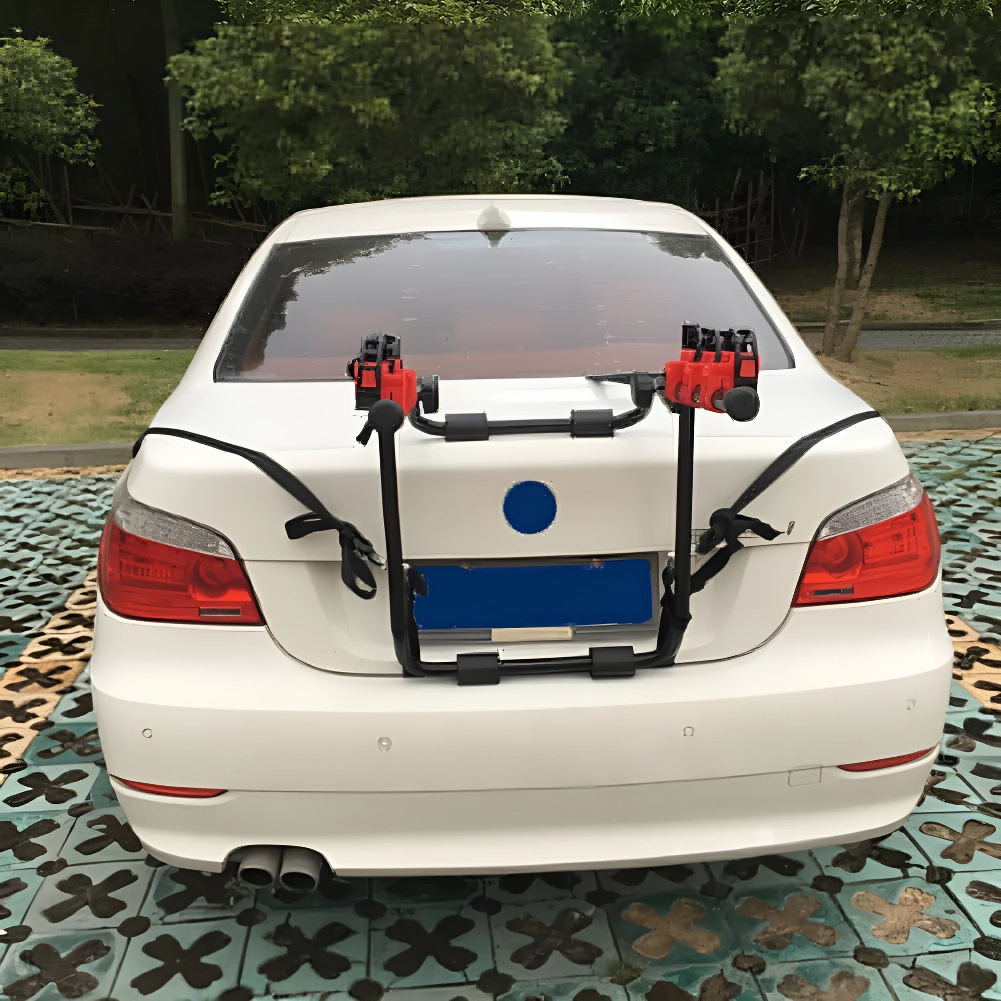 Black and red trunk-mounted car bike rack showing tie rope and pull belt attachment styles.