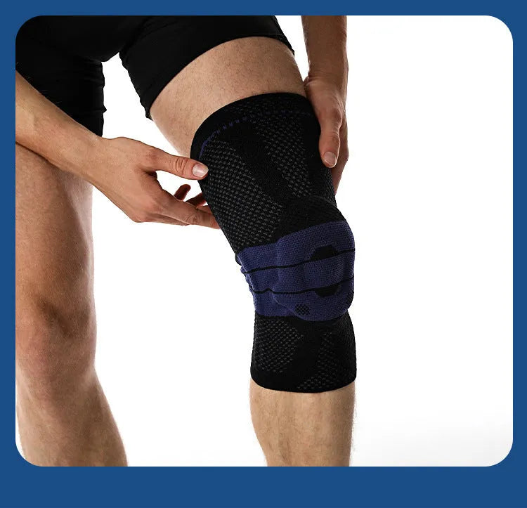 Adult sports kneecap or knee pad in black and blue colour, made from nylon spandex, shown on a knee.