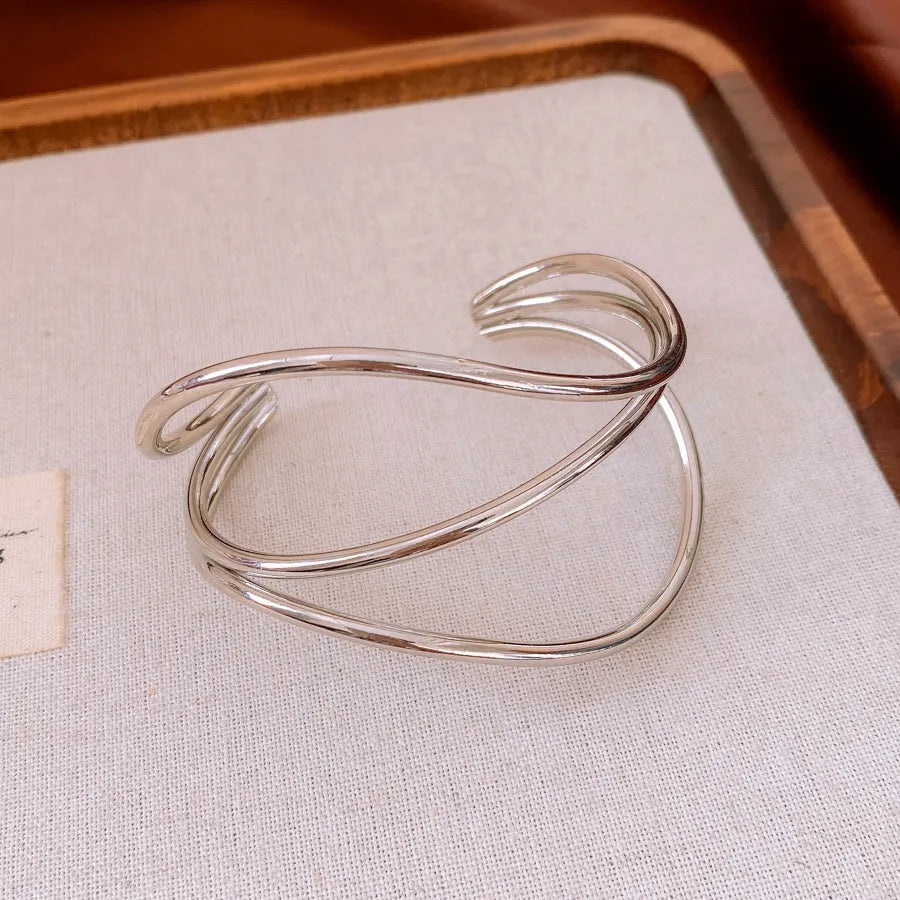 Geometric irregular lines open-ended metal bracelet in gold or silver with round popular element