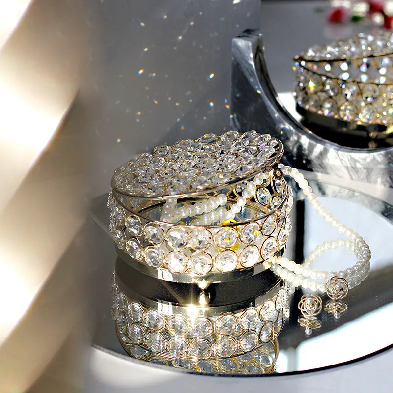 French gold iron frame transparent crystal glass jewelry storage box on a table