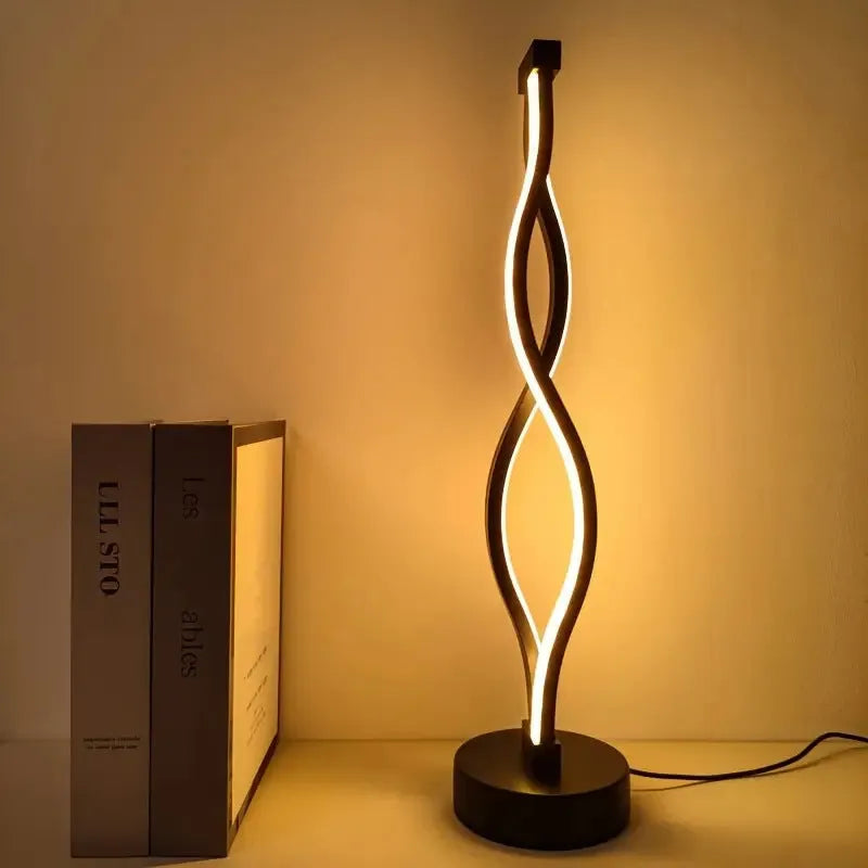 Black aluminium desk lamp with touch controls and three-colour dimming button