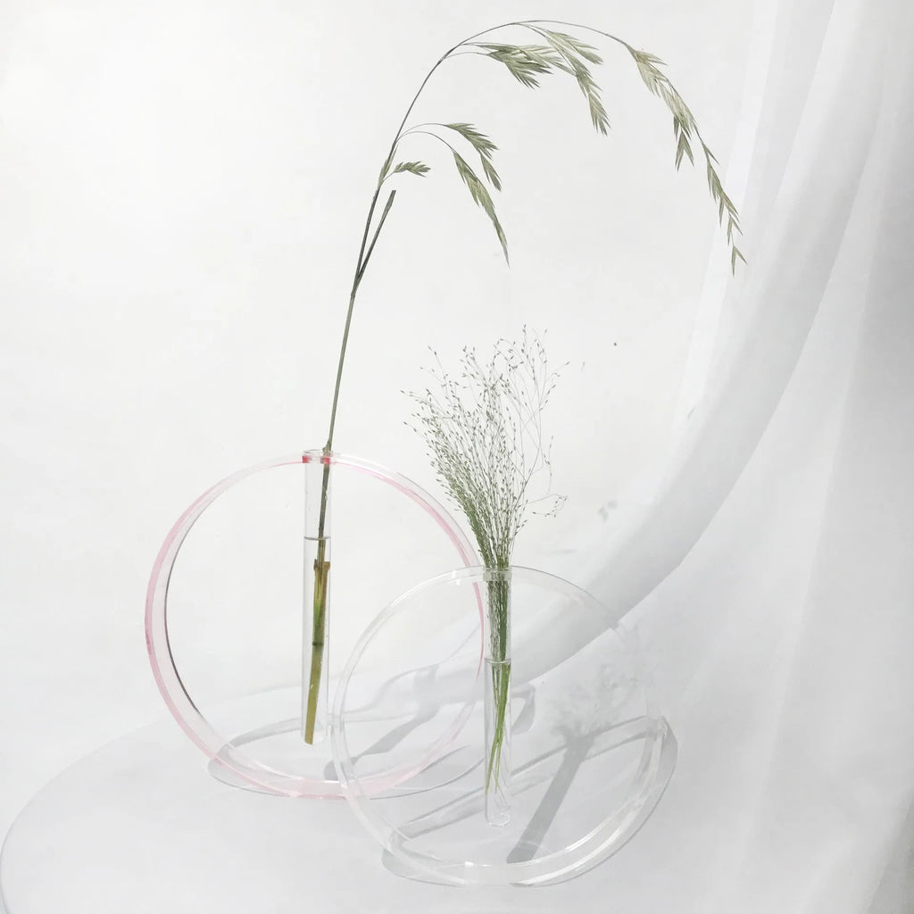 Handmade acrylic test tube vase with polished surface, shown in pink or transparent, small or large size options.