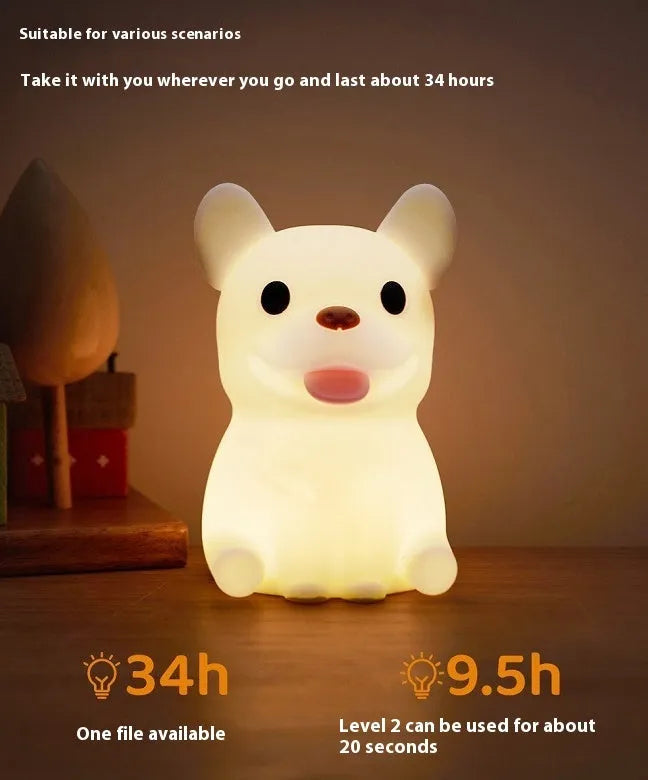 Silicone animal cartoon USB night light with Zodiac design on a bedside table.