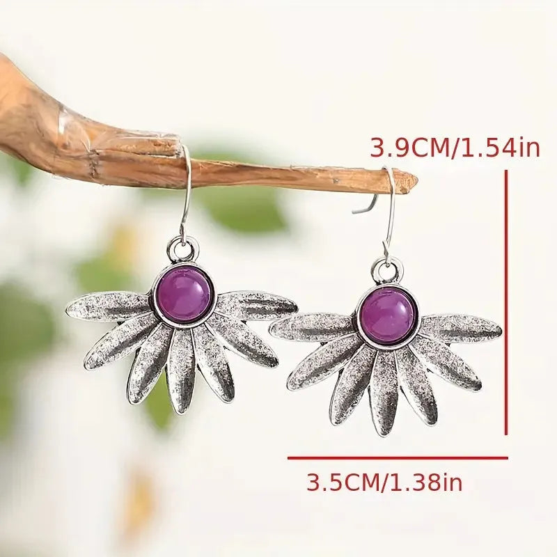 Purple Bohemian style earrings with floral and animal zodiac design in alloy and resin.