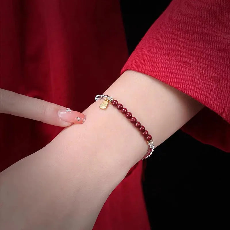 Silver geometric couple bracelet with round beads showing white K electroplated finish on 16cm length