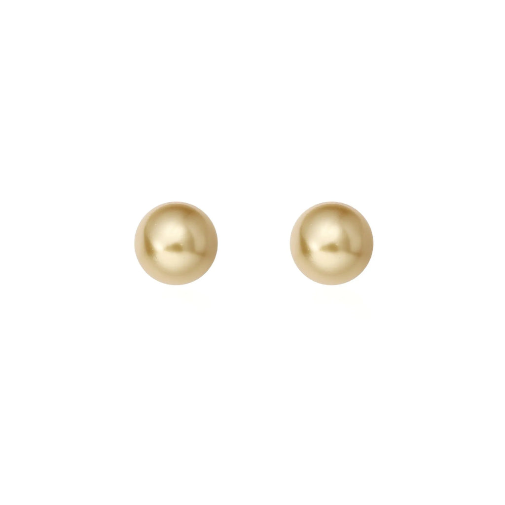 A pair of large pearl stud earrings with a geometric silver setting and an eight-pointed star detail on a white background.