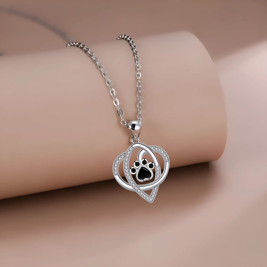 Women's copper necklace with dog paw pendant on cross chain