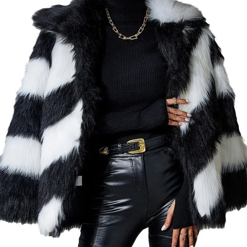 Black and white contrast lapel faux fur coat with a fur collar, shown on a model.