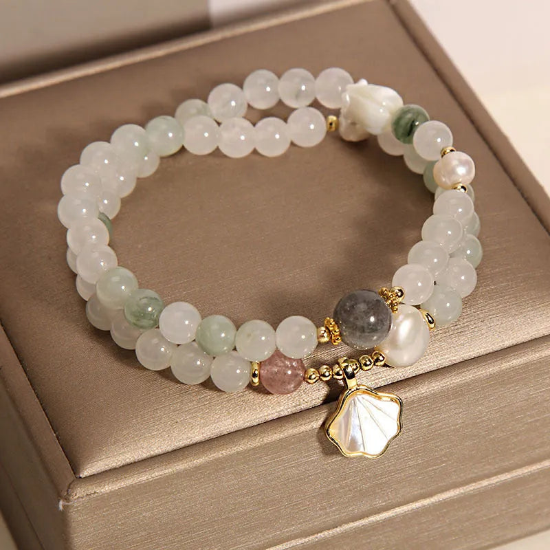 Women's crystal bracelet with artistic ginkgo leaf pendant and rhinestone accents