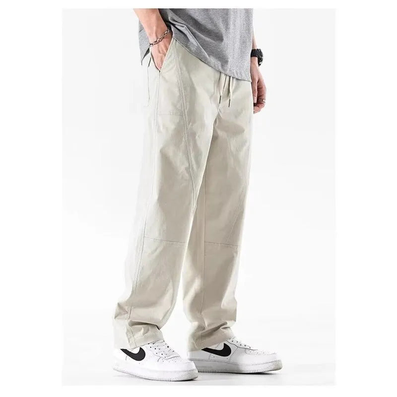 Antibacterial cotton wide-leg trousers in milky white showing the all-matching pants-mouth ankle design.