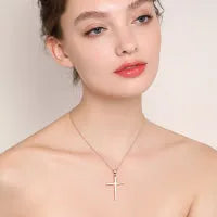 Sterling silver cross pendant necklace yellow gold plated 18 inch cable chain on white background