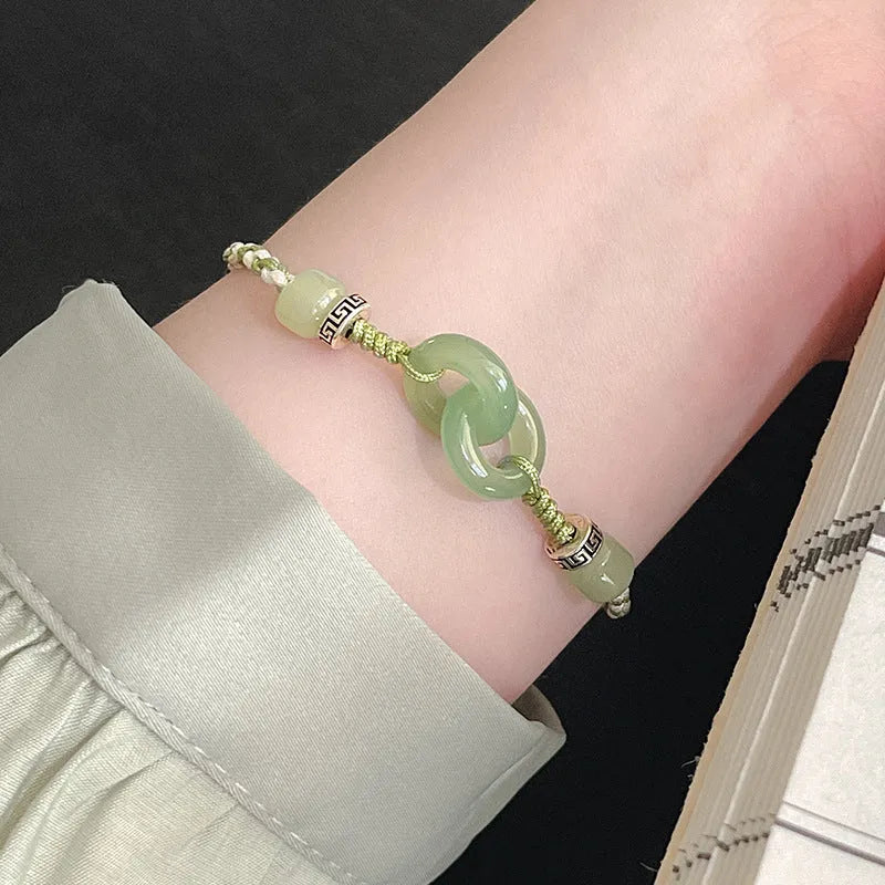 Green jade and copper ethnic bracelet with peace buckle centrepiece and double ring design