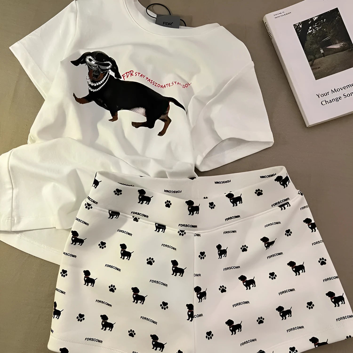 Girls short sleeve pyjama set with sausage dog print and sunglasses design in polyester