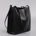 Brown genuine leather retro-style women's commuter bag with dual shoulder straps and external slit pocket.