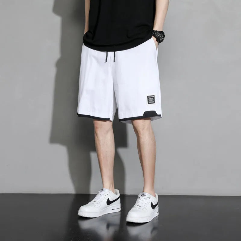 Boy wearing khaki cotton shorts with mid-waist, showing front view.