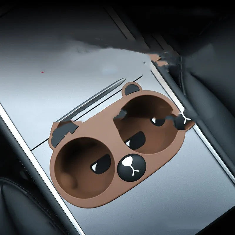 Silicone cup holder limiter insert for vehicle centre console in grey, tan, or pink colour.