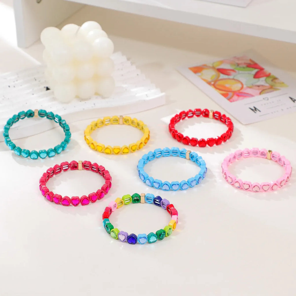 Rainbow enamel alloy heart stretch bracelet showing heart charm with diamond treatment in multiple colour options