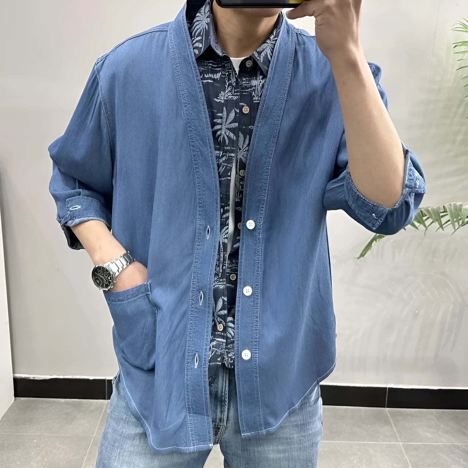 Men's dark blue casual denim coat with three-quarter sleeves and a V-neck collar.