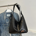 Women's retro large capacity PU bucket tote bag in Korean style with sewing thread detail, shown in coffee colour