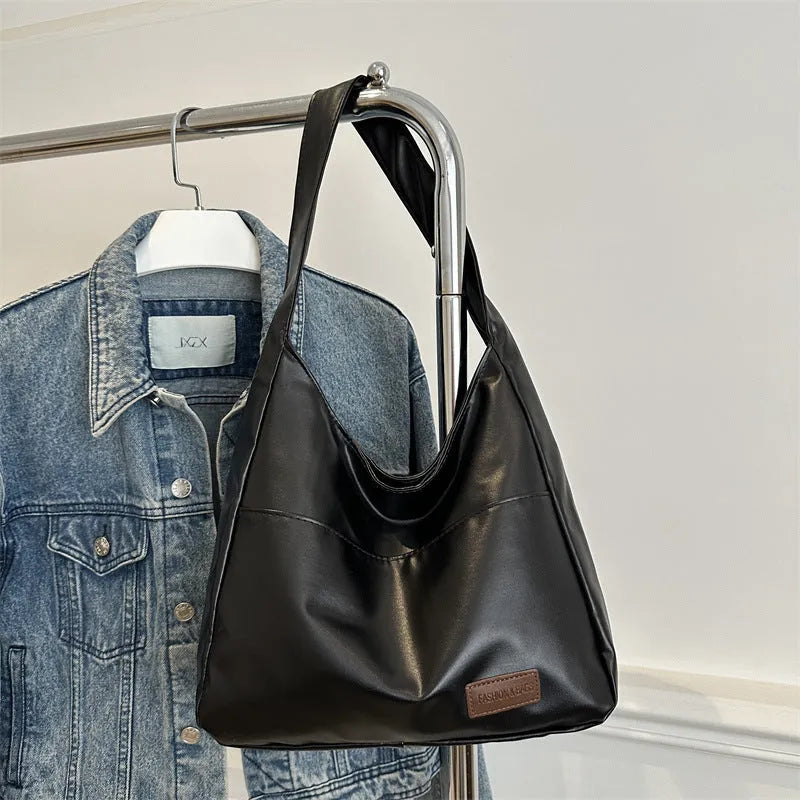 Women's retro large capacity PU bucket tote bag in Korean style with sewing thread detail, shown in coffee colour