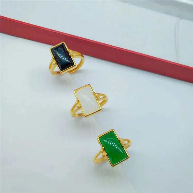 Adjustable brass gold-plated ring with a green gemstone inlay in a national style.