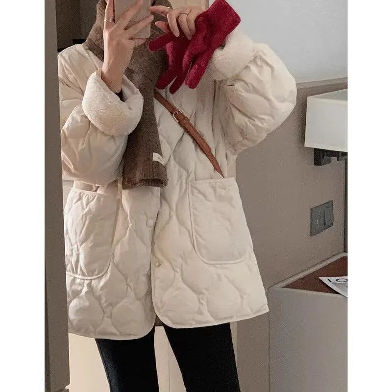 Women's collarless fleece jacket in Apricot with diamond pattern, loose straight fit, and polyester fabric